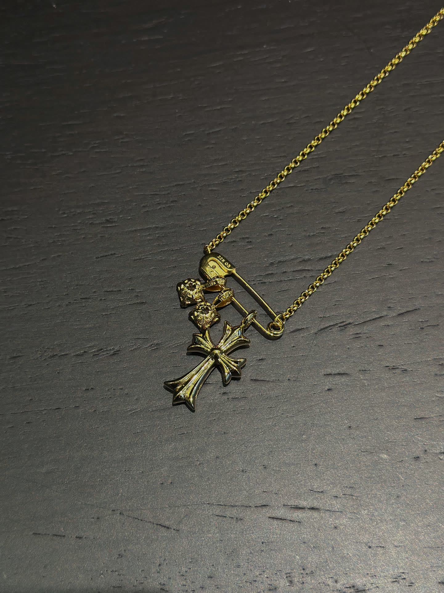 Chrome Hearts Gold Cross Pendant with Gemstones